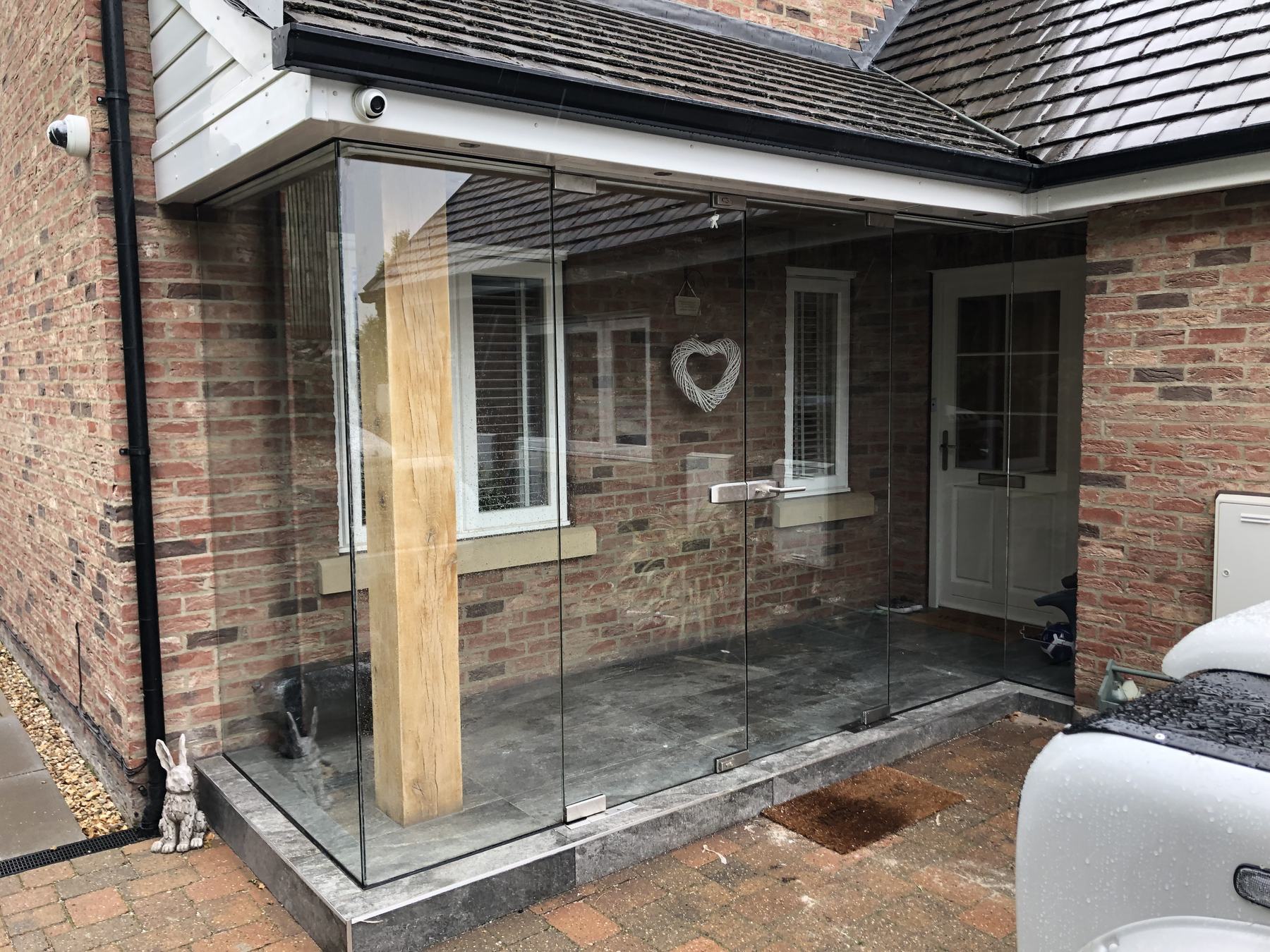 Frameless glass screen and doors installed by AJN Site Services