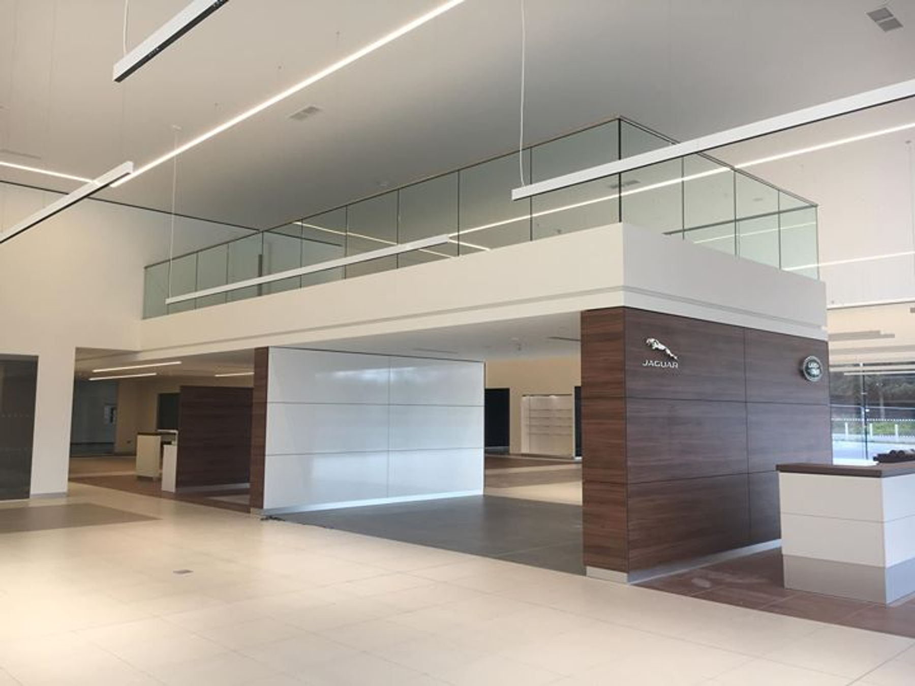 Glass mezzanine balustrade in car showroom