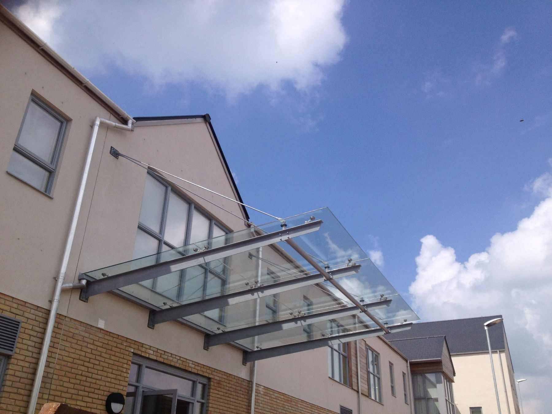 Bolt-fixed glass entrance canopy